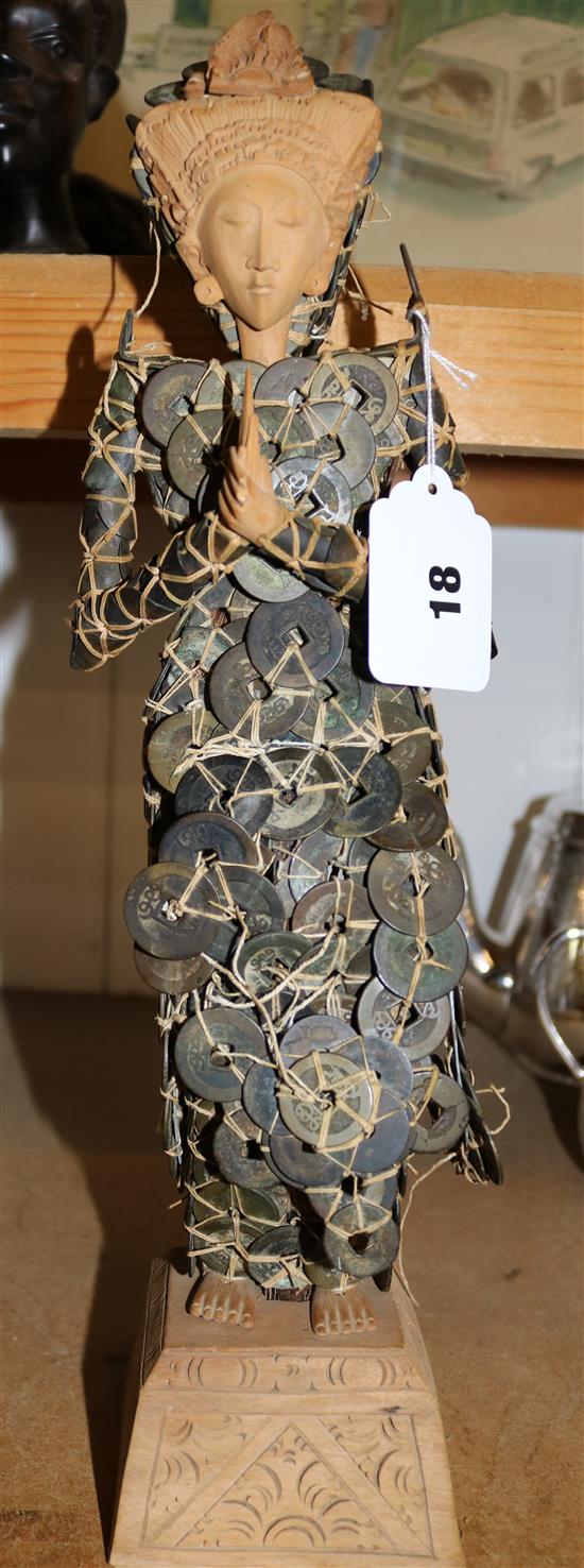 A Balinese coin wedding doll